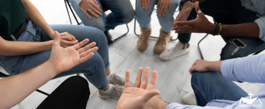 HHRC - Group of men discussing with only their hands shown