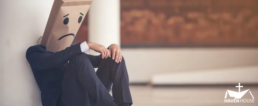 HHRC - Business man with a sad paper bag on his head