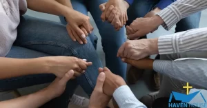 A Group of people holding hands | HHRC